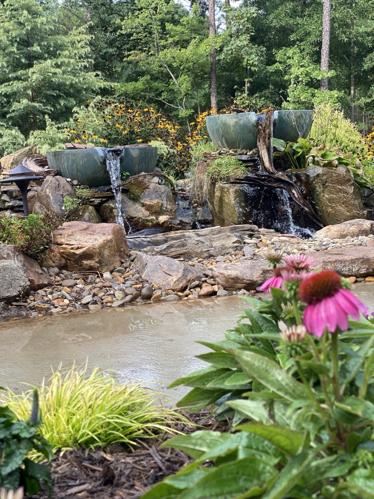 Two-tier garden fountain with cascading water
