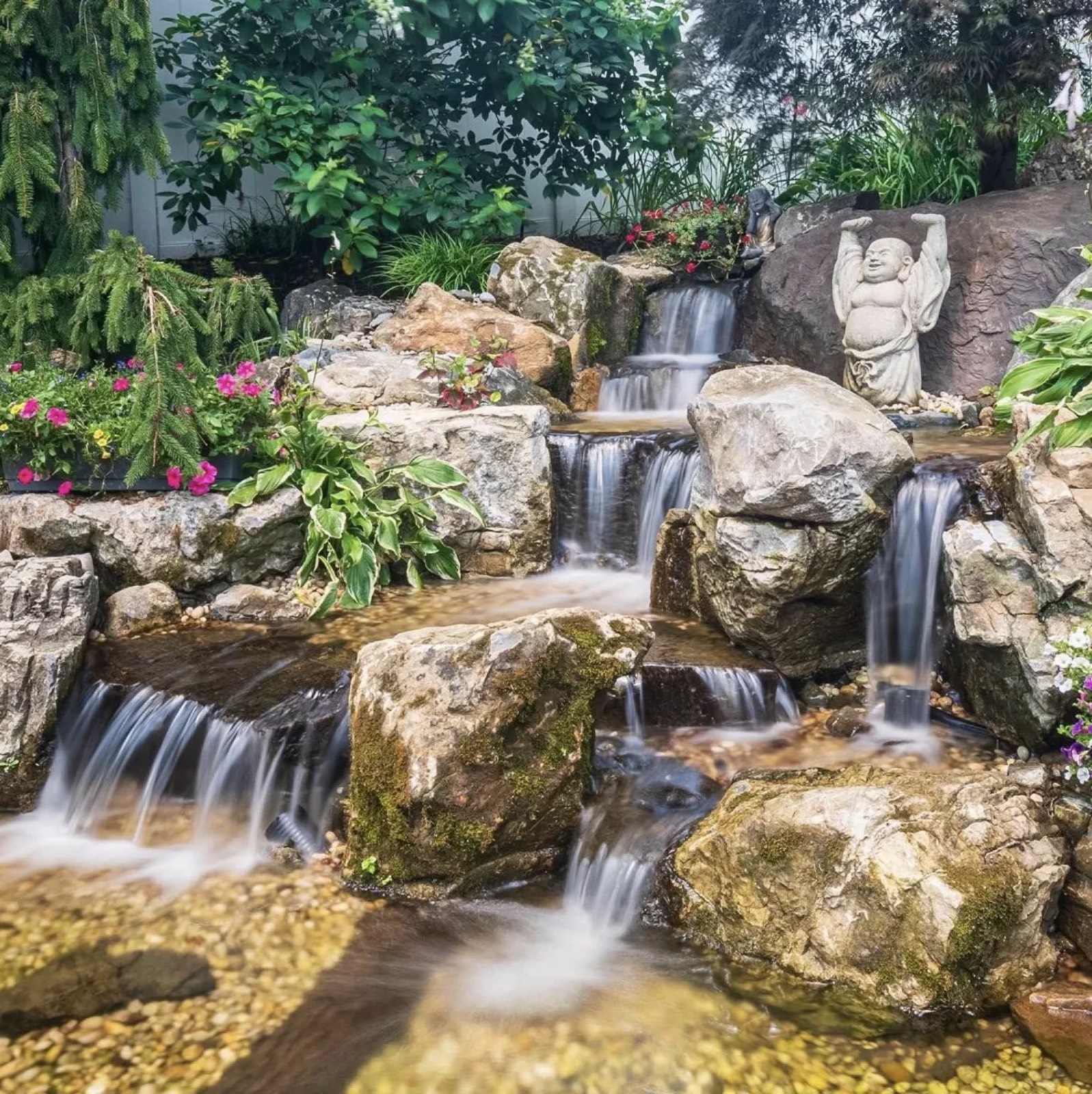 Custom pond and waterfall built by White's Waterscapes near Denver, NC